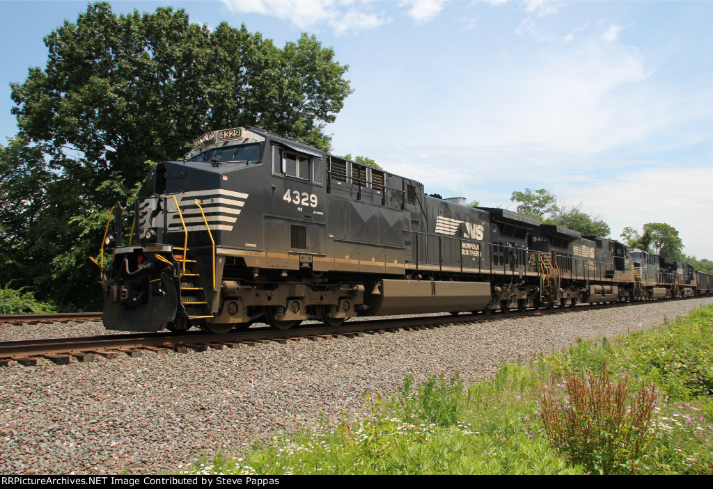 NS 4329 leads train 591 with coal hopper empties